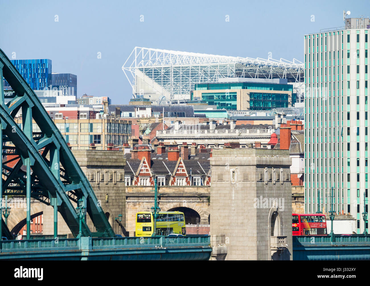 Newcastle: View over Tyne Bridge and city centre towards St James` park football stadium. Newcastle upon Tyne, England, UK Stock Photo